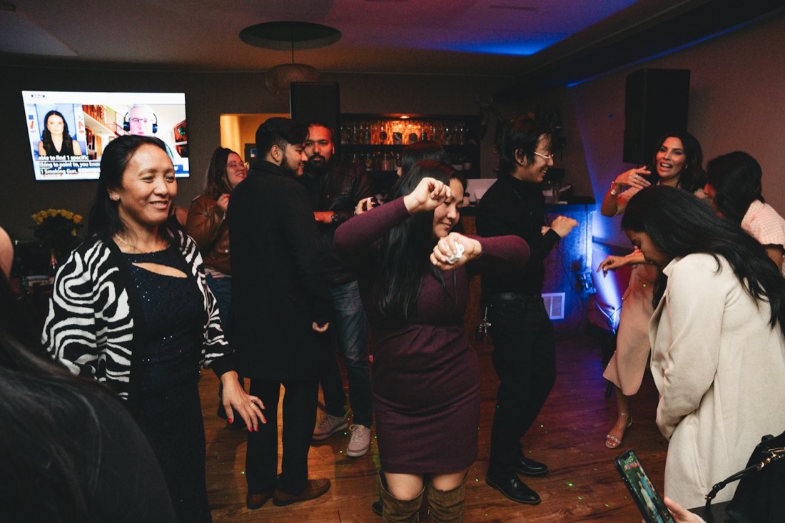 People dancing in a small bar