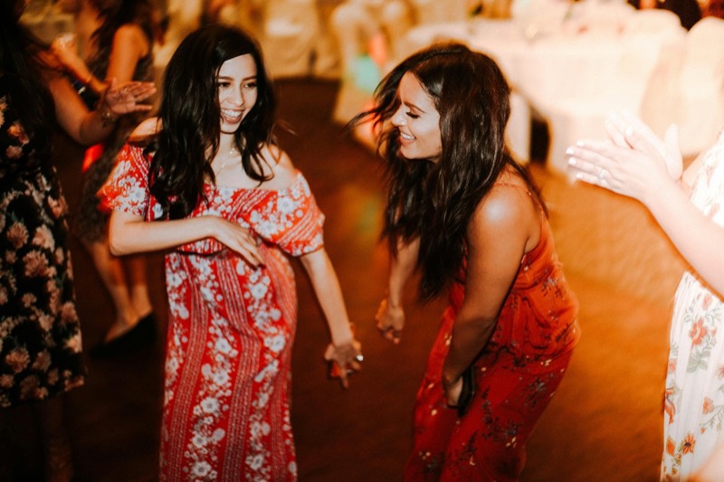 Two friends dancing at a student party